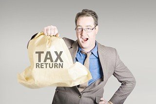 Accountant holding large tax return refund
